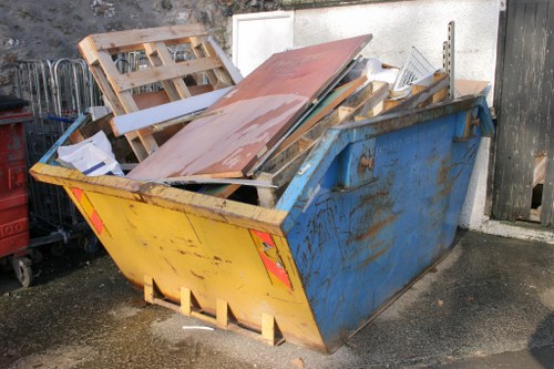 Experts handling and removing household items during a clearance service.