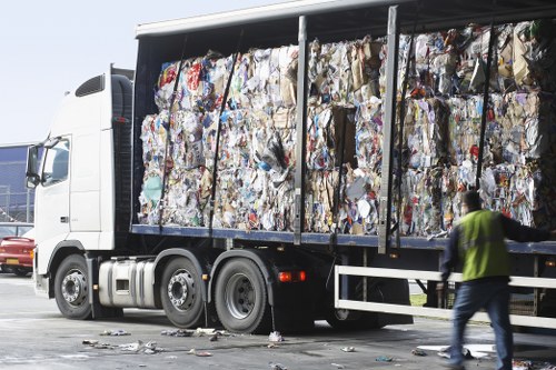 Workers organizing recyclable materials at a Southwark site