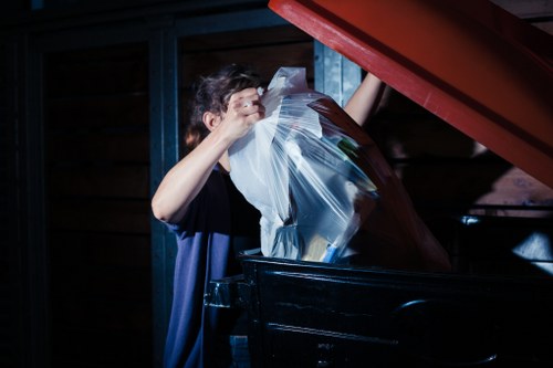 Professional team clearing clutter in a Southwark loft