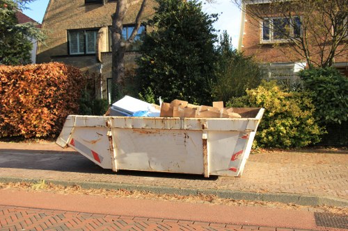 Expert team assessing a garden in Southwark for clearance work